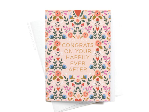 The Onderkast Studio Happily Ever After Floral Folded Greeting Note Set of 10 features premium card stock, a pink, peach, and blue floral design, “CONGRATS ON YOUR HAPPILY EVER AFTER” text, and includes envelopes. Printed in the USA.
