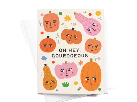 Send autumn smiles with the Oh Hey Gourdgeous Greeting Card from Onderkast Studio—featuring playful pumpkins and gourds with faces, festive confetti, and bold lettering for a fun seasonal touch!.
