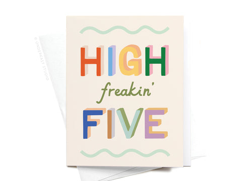 Celebrate any occasion with the High Freakin’ Five Greeting Card by Onderkast Studio—featuring bold, colorful letters and playful wavy green lines. Printed in the USA, it’s the perfect congrats card for anyone special.