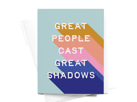 The Great People Cast Great Shadows Greeting Card by Onderkast Studio features the phrase in white, with each word casting a colored shadow on a light blue background.