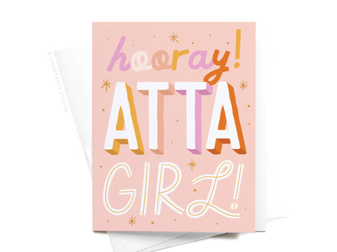 The Onderkast Studio Hooray Atta Girl Greeting Card features a pink background with “hooray! ATTA GIRL!” in bold, colorful letters and star accents. Paired with a white envelope, it’s perfect for congratulations.