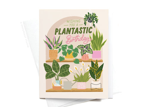 The Wishing You a Plantastic Birthday Greeting Card by Onderkast Studio features potted houseplant illustrations and green and pink text—ideal for any plant lover’s birthday.