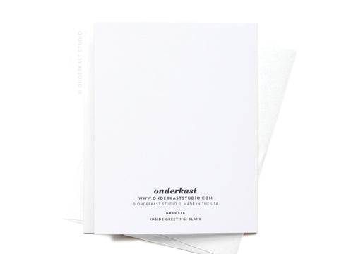 The Sweet Spot Between Acne & Wrinkles Greeting Card by Onderkast Studio is a blank white card with black-printed contact and product info at the bottom, shown with a slightly visible white envelope behind it.