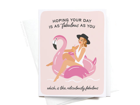 Fabulous Flamingo Floatie Greeting Card by Onderkast Studio: A light premium card printed in the USA, featuring a woman on a pink flamingo float. Front text: Hoping your day is as fabulous as you, which is like, ridiculously fabulous.
