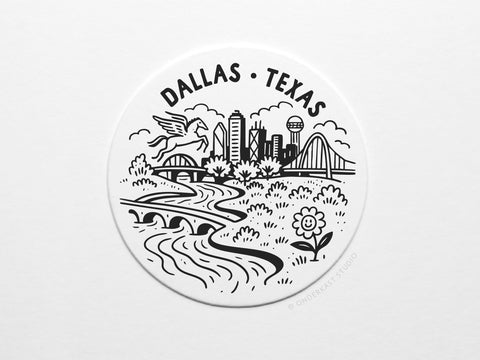 This Dallas Texas Skyline Letterpress Coaster Set by Onderkast Studio features a black and white circular illustration of Dallas with buildings, bridges, Pegasus, Reunion Tower, trees, and river—ideal for stylish tabletop decor.