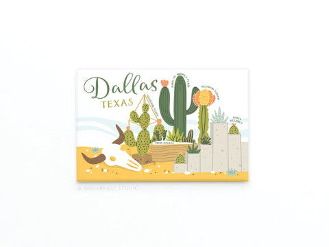 Dallas Succulent Skyline Refrigerator Magnet by Onderkast Studio features cacti, desert plants, an animal skull, and rocks with Dallas, Texas in green and yellow script—perfect for fans of Texan charm or as a unique fridge accessory.