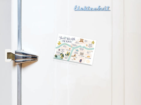 A white fridge door with a metal handle showcases the Onderkast Studio Fort Worth Map Refrigerator Magnet, its Texas-inspired design standing out against a minimal background.