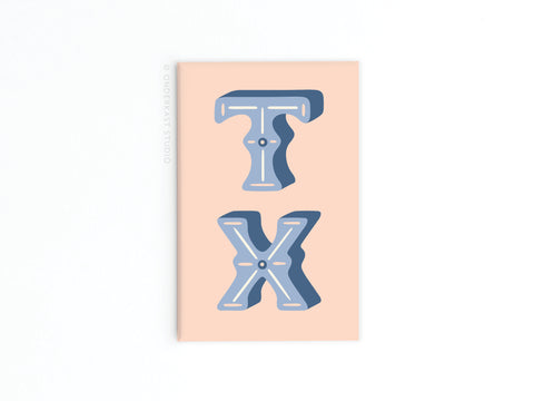 The TX Refrigerator Magnet by Onderkast Studio features bold, blue 3D T and X letters with white accents on a light peach rectangular background, capturing a Lone Star State–inspired design.