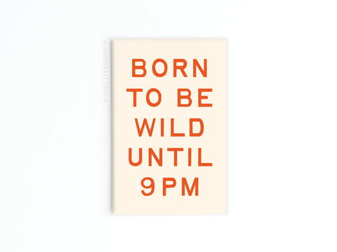 The Born To Be Wild Refrigerator Magnet by Onderkast Studio features bold orange BORN TO BE WILD UNTIL 9PM text on a cream background, making it a fun, vibrant addition to any fridge.