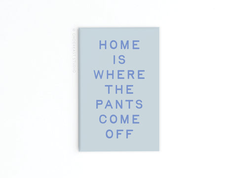 Add a playful touch to your space with the Onderkast Studio Home Is Where the Pants Come Off Refrigerator Magnet, featuring the funny phrase in bold purple letters on a light blue and white background.
