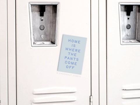 The Onderkast Studio Home Is Where the Pants Come Off Refrigerator Magnet adds humor to your home with its light blue design and bold uppercase text—perfect for decorating your fridge or gifting a fun touch to any space.