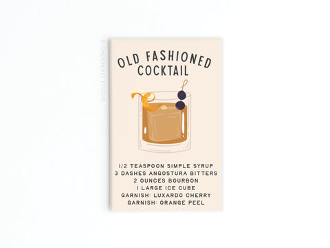 The Onderkast Studio Old Fashioned Cocktail Recipe Refrigerator Magnet features an illustrated drink with cherry and orange peel, lists bourbon, bitters, simple syrup as ingredients, and is a stylish way to display your mixology skills.