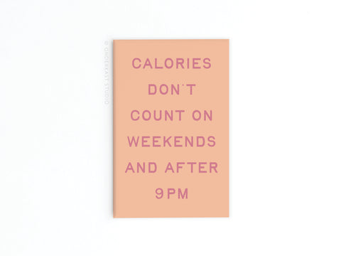 The Calories Don’t Count Refrigerator Magnet by Onderkast Studio features pink text on a peach background: CALORIES DONT COUNT ON WEEKENDS AND AFTER 9PM—a fun, humorous magnet for your kitchen fridge.