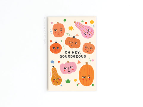 The Oh Hey Gourdgeous Refrigerator Magnet by Onderkast Studio features pumpkins and gourds with faces, colorful confetti, and bold text—perfect for Fall decor or adding playful charm to your kitchen.