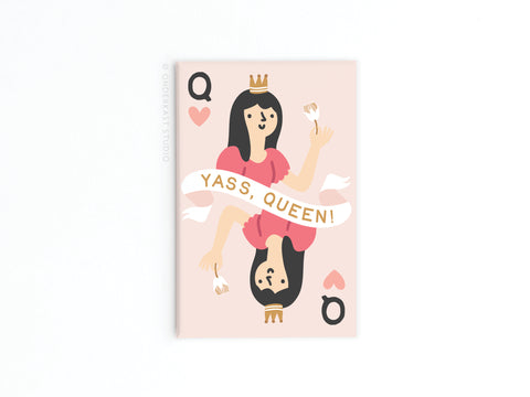 The Onderkast Studio Yass Queen of Hearts Refrigerator Magnet features a bold queen with long dark hair, crown, pink dress, cupcakes, and heart suits. “YASS, QUEEN!” adds flair—perfect as a fun accent on any fridge or metal surface.
