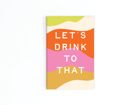 The Onderkast Studio Let’s Drink to That Refrigerator Magnet features stylish wavy stripes in green, orange, pink, yellow, and beige with bold white text that says “LETS DRINK TO THAT.”.