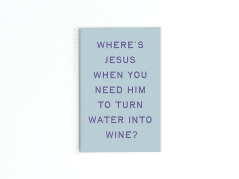 The Water Into Wine Refrigerator Magnet by Onderkast Studio features bold purple text on light blue, asking “WHERES JESUS WHEN YOU NEED HIM TO TURN WATER INTO WINE?” Vibrant colors pop against a plain white background.