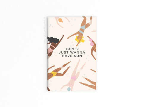 The Girls Just Wanna Have Sun Refrigerator Magnet by Onderkast Studio shows women in swimsuits swimming underwater from above, surrounded by playful bubbles, with the text GIRLS JUST WANNA HAVE SUN on a light background.