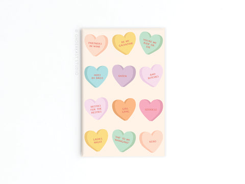 The Galentine’s Candy Hearts Refrigerator Magnet by Onderkast Studio features twelve pastel hearts with playful friendship and love phrases like PARTNERS IN WINE, YOURE MY RIDE OR DIE, BAD BITCHES, LADIES NIGHT, and XOXO.