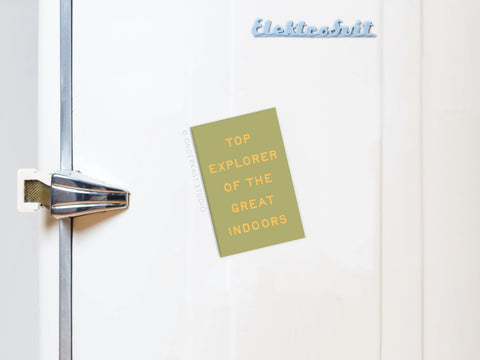 A yellow Explorer of the Great Indoors Refrigerator Magnet by Onderkast Studio is displayed on a white retro fridge with bright colors, a chrome handle, and the brand’s logo at the top right.