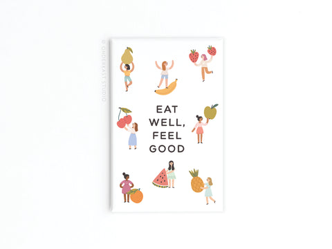 The Eat Well Feel Good Refrigerator Magnet by Onderkast Studio features vibrant women with various fruits and the motivational text EAT WELL, FEEL GOOD—a perfect inspirational accent for your kitchen décor.