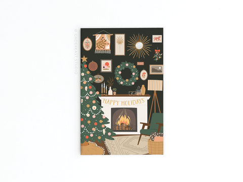 Onderkast Studios Happy Holidays Cozy Fireplace refrigerator magnet features a festive living room scene with a decorated fireplace, Christmas tree, ornaments, wreaths, and wrapped gifts.