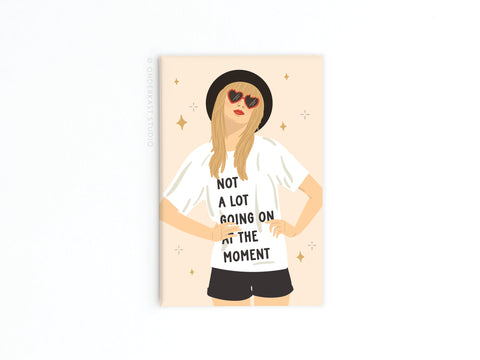High-quality illustration of a woman with long blonde hair, red heart sunglasses, and a Not a lot going on at the moment shirt, as seen on Onderkast Studio’s TS Red Refrigerator Magnet. Captures Taylors iconic style.