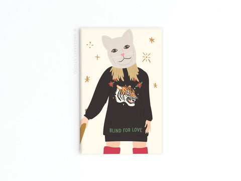 Channeling Taylor Swifts LWYMMD era, this TS Reputation Refrigerator Magnet from Onderkast Studio features a cat-masked figure in a BLIND FOR LOVE sweater with tiger design, long blonde hair, red boots, and an umbrella—a true Reputation Magnet!.