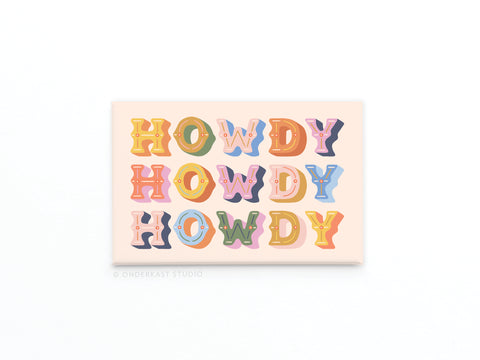 Add charm to your fridge with the Howdy Howdy Howdy Refrigerator Magnet by Onderkast Studio, featuring “Howdy” repeated in colorful, playful letters on a light pink background. Printed in the USA.