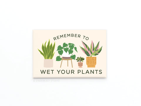 The Onderkast Studio Remember to Wet Your Plants Refrigerator Magnet features four potted plants and witty text, adding playful humor and a helpful reminder to any decor.