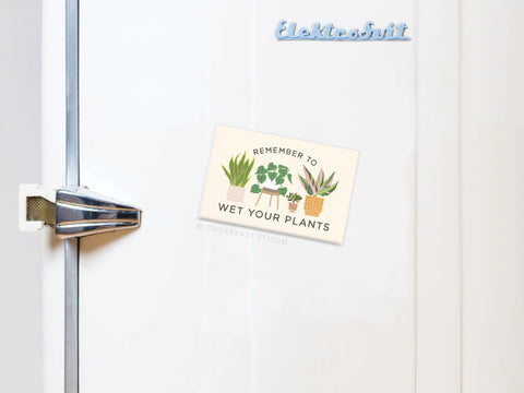 The Remember to Wet Your Plants Refrigerator Magnet by Onderkast Studio features three playful potted plants and adds a humorous reminder with quirky decor to your fridge.