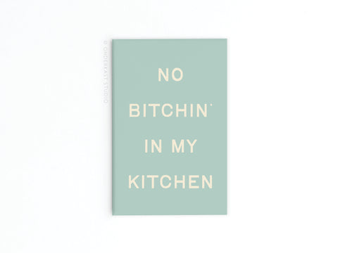 The Onderkast Studio No Bitchin’ In My Kitchen refrigerator magnet features light green color with white text, made in the USA—a fun and quirky addition to your kitchen decor or fridge collection.