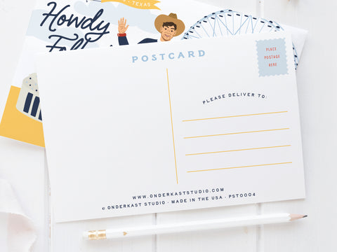 The Onderkast Studio Howdy Folks Postcard features address lines, a stamp spot, and partial illustrations of Big Tex, the Ferris wheel, and “Howdy Fall” text. A pencil and white fabric lie nearby on a white background.