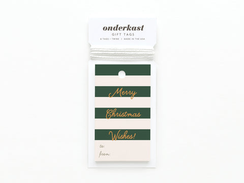 The Merry Christmas Wishes Stripe Gift Tag by Onderkast Studio features vibrant green and ivory stripes, gold Merry Christmas Wishes script, spaces for to/from, and comes with white twine.