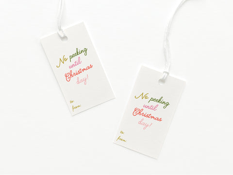 The Onderkast Studio No Peeking Until Christmas Day gift tags feature vibrant text, premium card stock, to/from lines, and come with string—perfect for your holiday gifting.