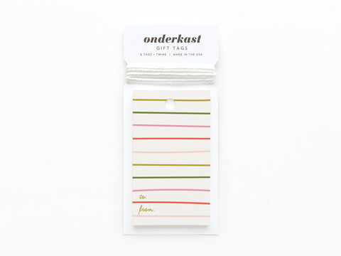 The Onderkast Studio Green & Pink Stripes Gift Tag pack includes six USA-printed tags on quality cardstock with blank To/From fields, twine, and a pastel green/pink design with gold stripes, shown on a white background.