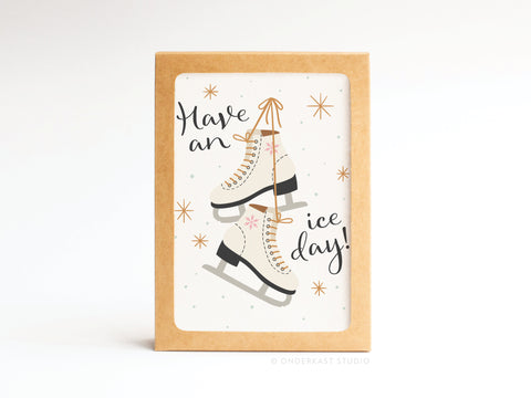 Onderkast Studio’s Have an Ice Day! Ice Skates Folded Greeting Note Set of 10 features ice skates with star accents and cheerful text on a white background. Each card is hand-assembled in the USA for a personal touch.