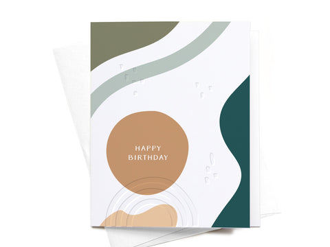 The Happy Birthday Abstract Letterpress Greeting Card by Onderkast Studio features modern wavy shapes in green, white, teal, and tan with HAPPY BIRTHDAY in a tan circle. Includes a white envelope. FINAL STOCK.