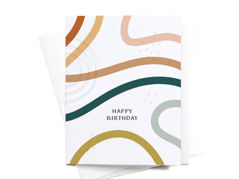 The Happy Birthday Streamers Letterpress Greeting Card by Onderkast Studio features abstract wavy lines in brown, gold, green, and peach on white, with “HAPPY BIRTHDAY” text and raised braille dots. Envelope included.