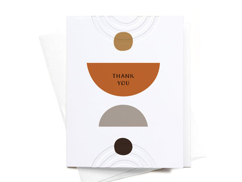 The Thank You Modern Shapes Letterpress Greeting Card by Onderkast Studio features geometric brown and beige shapes with THANK YOU in the center of an orange semicircle, paired with a white envelope for a premium feel. FINAL STOCK.