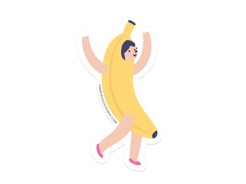 The Banana Girl Sticker by Onderkast Studio features a cheerful cartoon character in a banana costume, smiling with arms raised and one leg lifted. This playful, water-resistant vinyl sticker is perfect for adding fun to any surface.