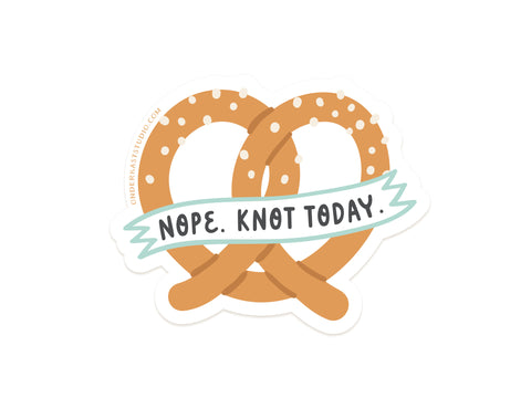 The Nope Knot Today Pretzel Sticker by Onderkast Studio features a golden brown soft pretzel with white salt specks and a NOPE. KNOT TODAY banner, printed on durable, water-resistant vinyl with a crisp white background.