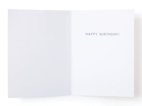 An open Onderkast Studio Old As Balls Greeting Card with a blank left page and HAPPY BIRTHDAY! in blue on the right, delivering a premium touch for birthday celebrations.